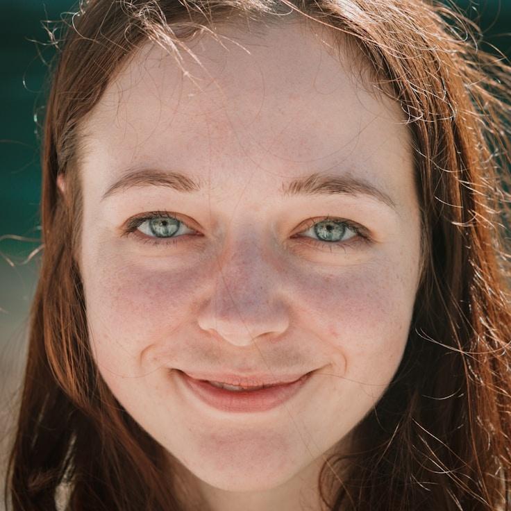 Kaveri Mehta, Lead Design Curator at Wild Lounge Kernel, reviewing corporate floral arrangements